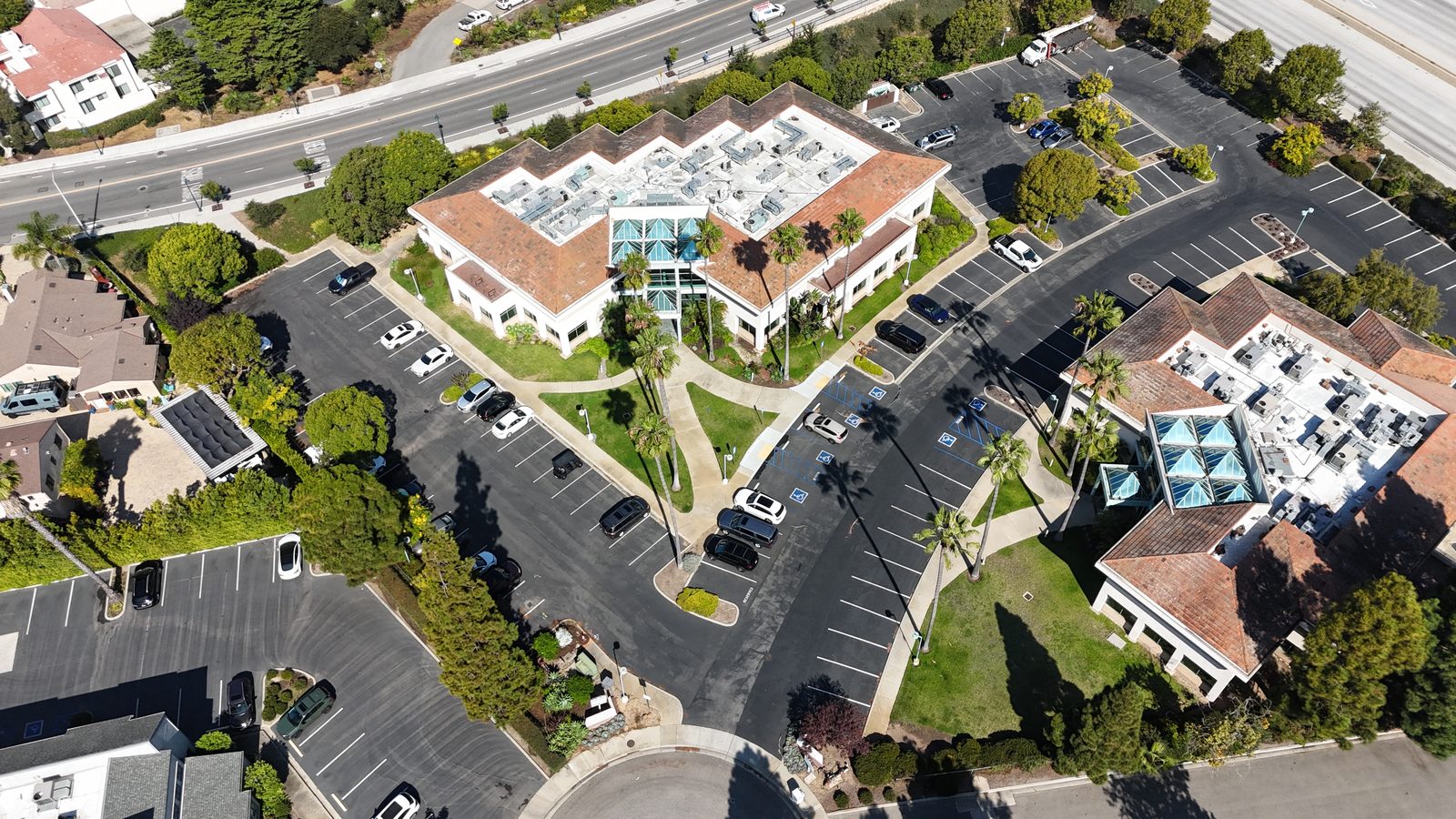 Overhead aerial showing the parking field around the building
